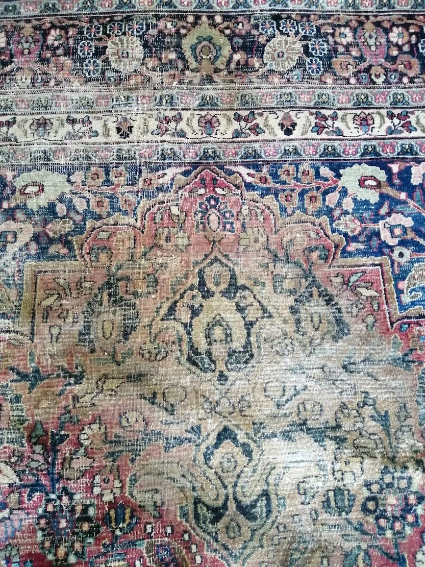 An antique Heriz red ground carpet, 420 x 306cm